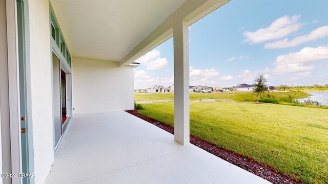 view of patio featuring a water view