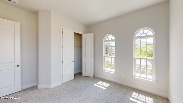 unfurnished bedroom with baseboards and carpet floors