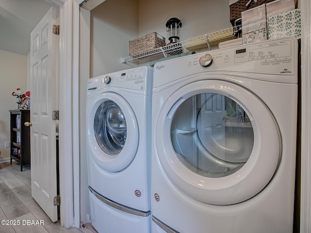 washroom with washer and dryer and laundry area