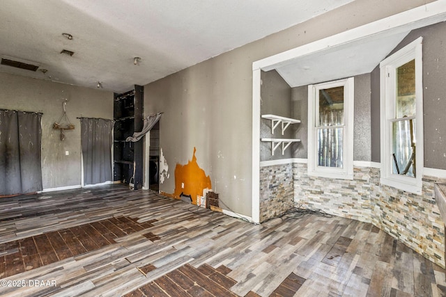 empty room with wood-type flooring