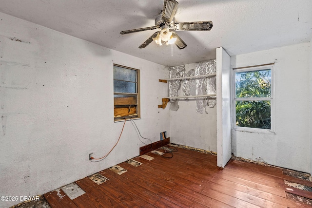 spare room featuring hardwood / wood-style floors and ceiling fan