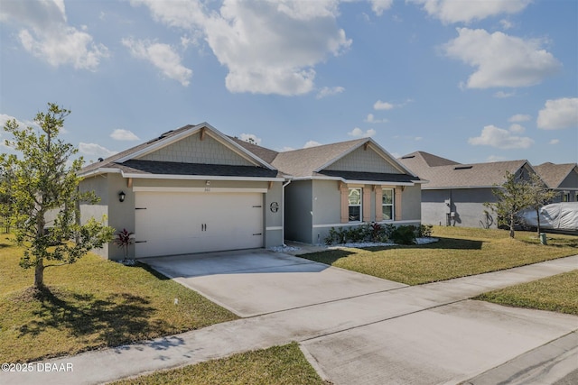 view of front of home featuring a garage and a front lawn