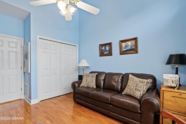 living room with high vaulted ceiling, wood-type flooring, and ceiling fan