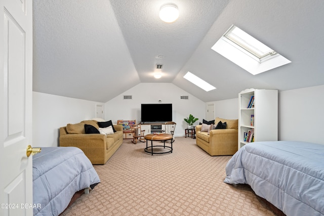 bedroom featuring carpet flooring, lofted ceiling, and a textured ceiling