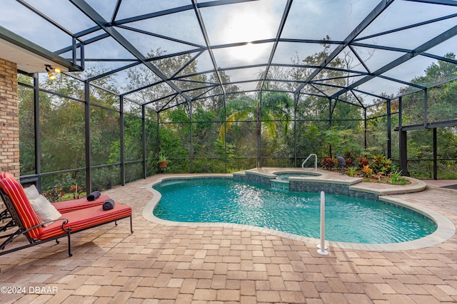 view of swimming pool with a patio, glass enclosure, and an in ground hot tub