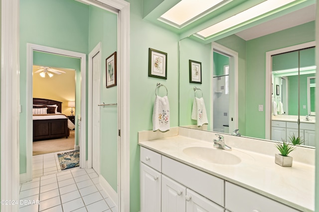 bathroom featuring vanity, ceiling fan, and tile patterned floors