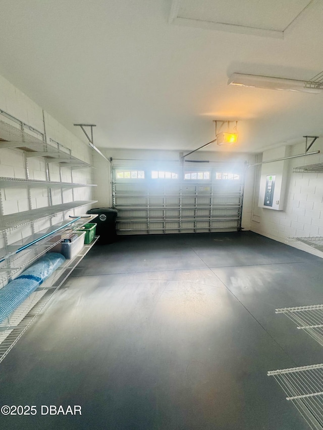 306 Coral Reef Way, Daytona Beach, FL 32124 - garage with electric panel and a garage door opener