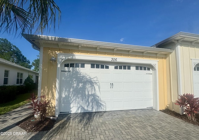 306 Coral Reef Way, Daytona Beach, FL 32124 - garage with decorative driveway
