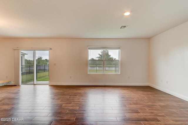 569 Armoyan Way, New Smyrna Beach, FL 32168 - unfurnished room featuring dark wood-type flooring and baseboards