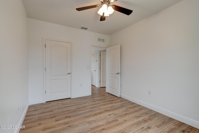 569 Armoyan Way, New Smyrna Beach, FL 32168 - unfurnished bedroom featuring light wood-style flooring, baseboards, and ceiling fan