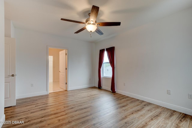569 Armoyan Way, New Smyrna Beach, FL 32168 - unfurnished room featuring ceiling fan, wood finished floors, and baseboards