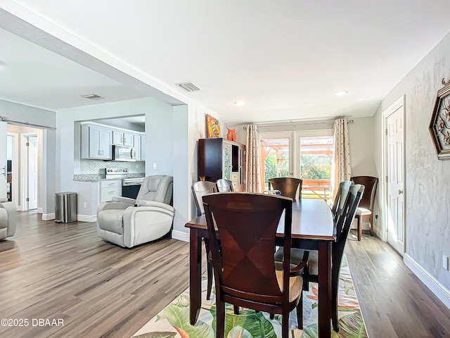 dining area with light hardwood / wood-style flooring