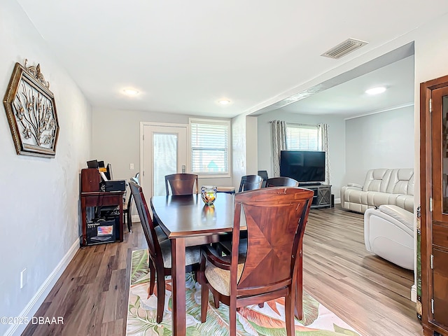 dining room featuring light hardwood / wood-style flooring