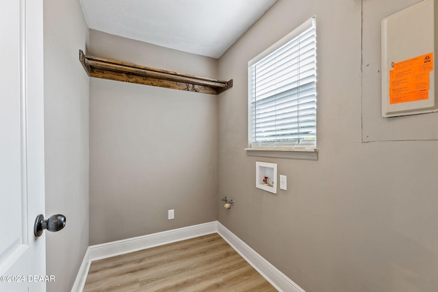 laundry room featuring light hardwood / wood-style floors, gas dryer hookup, and hookup for a washing machine