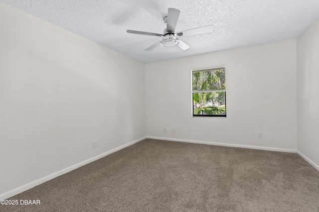 empty room with ceiling fan, carpet, and a textured ceiling