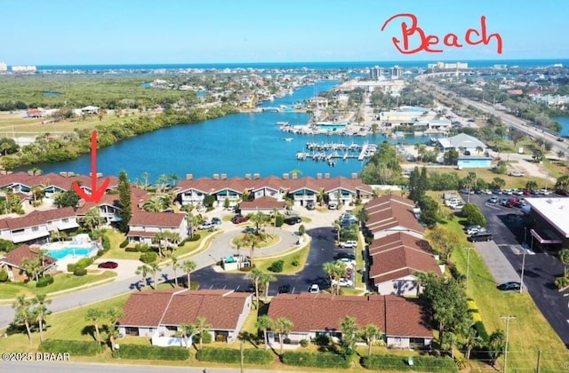 birds eye view of property with a water view