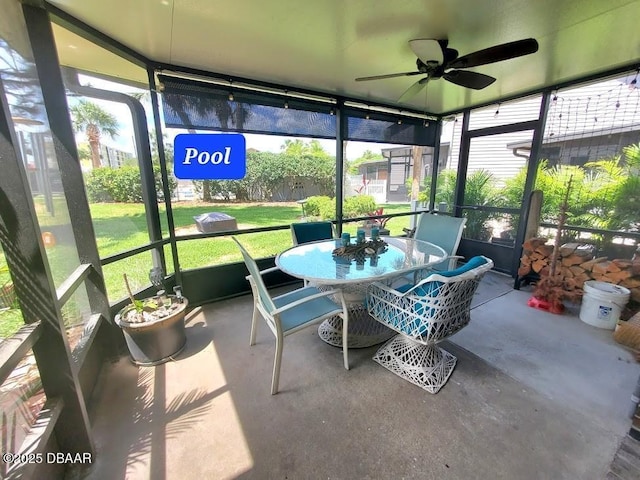 113 Lagoon Ct, New Smyrna Beach, FL 32169 - sunroom with ceiling fan and outdoor dining area