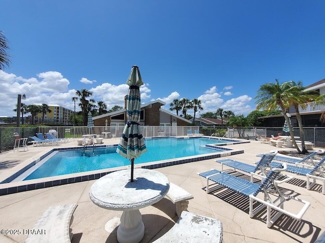 view of pool featuring a patio