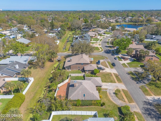 birds eye view of property featuring a residential view and a water view