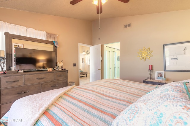 bedroom featuring visible vents, ceiling fan, and lofted ceiling