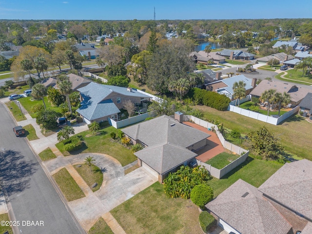 aerial view with a residential view and a water view