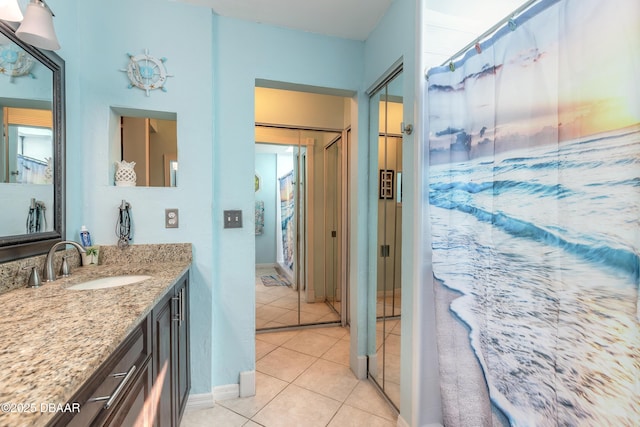 bathroom featuring tile patterned flooring and vanity