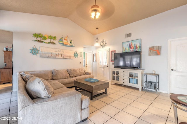 living room featuring vaulted ceiling, light tile patterned floors, a ceiling fan, and visible vents