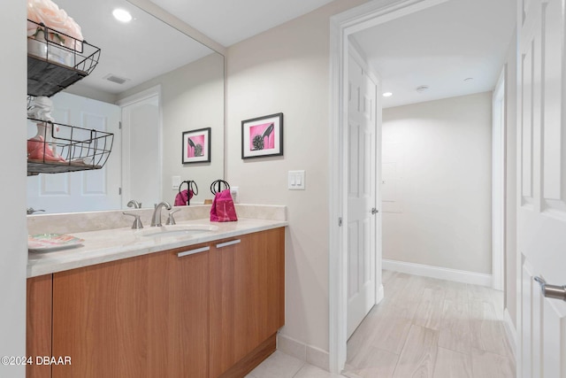 241 Riverside Dr Unit 1401-2, Holly Hill, FL 32117 - bathroom with vanity, baseboards, and recessed lighting