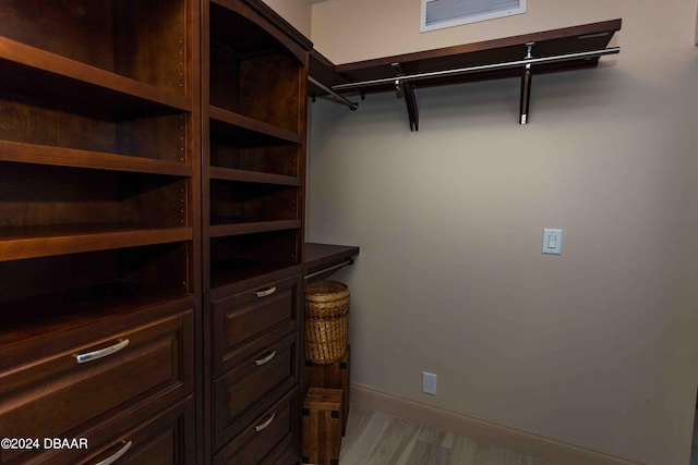 241 Riverside Dr Unit 1401-2, Holly Hill, FL 32117 - walk in closet with light wood-style flooring