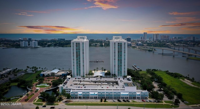 aerial view at dusk with a water view