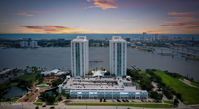 241 Riverside Dr Unit 1401-2, Holly Hill, FL 32117 - aerial view at dusk of a water view, a view of city, and a notable bridge