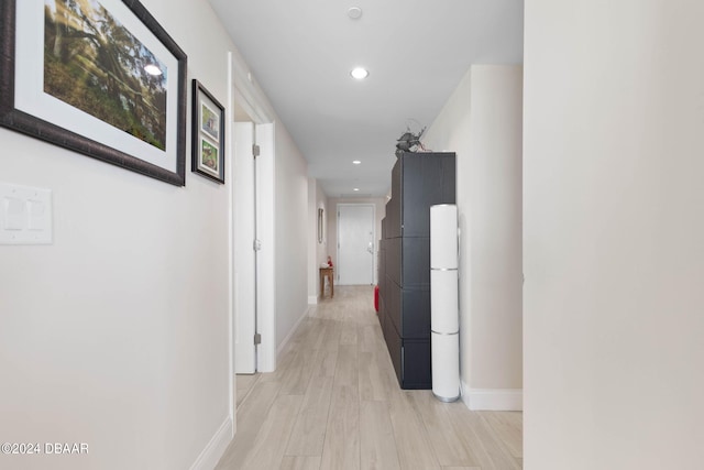 hallway with light wood-type flooring