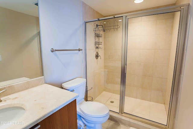 bathroom with walk in shower, toilet, vanity, and tile patterned floors