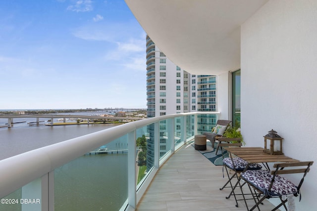 balcony featuring a water view