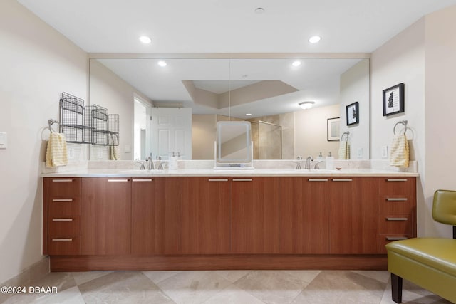 bathroom with walk in shower and vanity