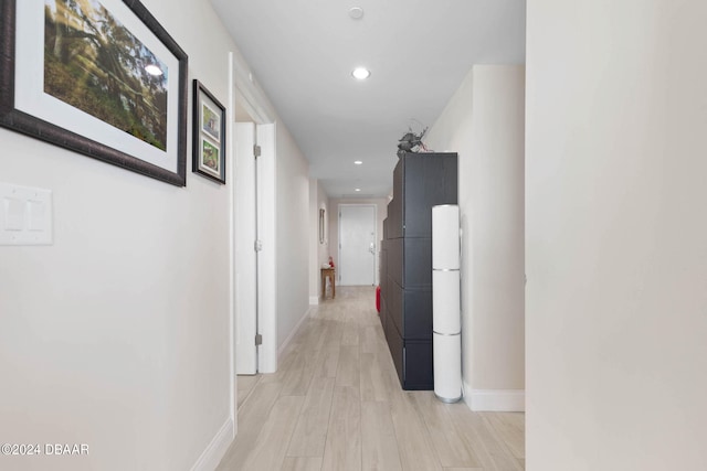 corridor with light wood-type flooring