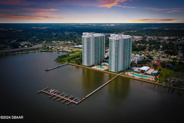 aerial view at dusk with a water view