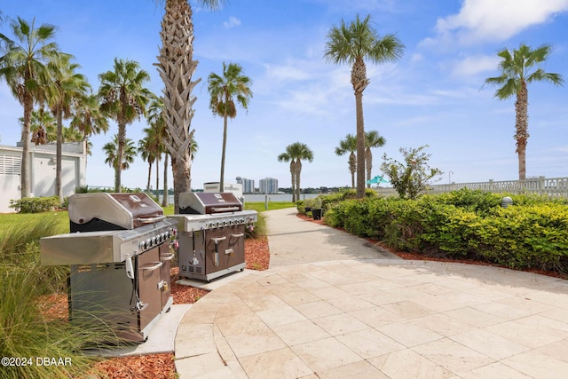 241 Riverside Dr Unit 1401-2, Holly Hill, FL 32117 - surrounding community with fence and a patio