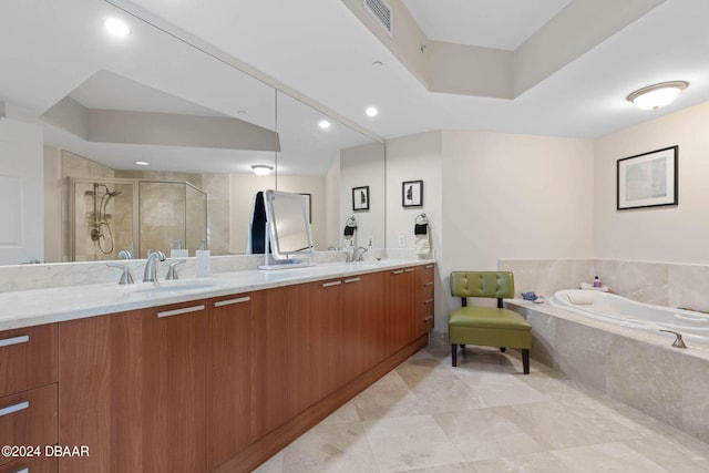 bathroom with a tray ceiling, plus walk in shower, and vanity