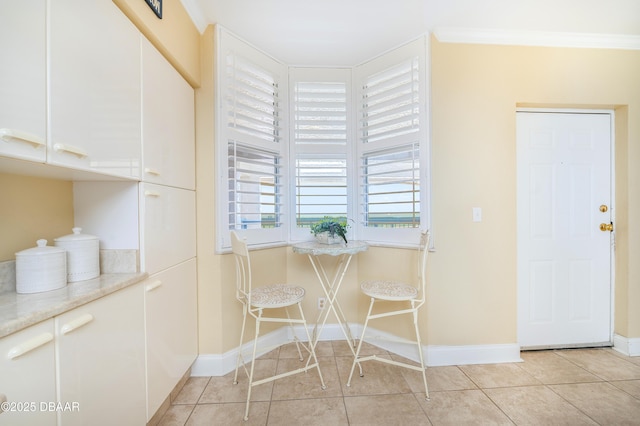 4545 S Atlantic Ave Unit 3704, Ponce Inlet, FL 32127 - dining space featuring baseboards, ornamental molding, and light tile patterned flooring