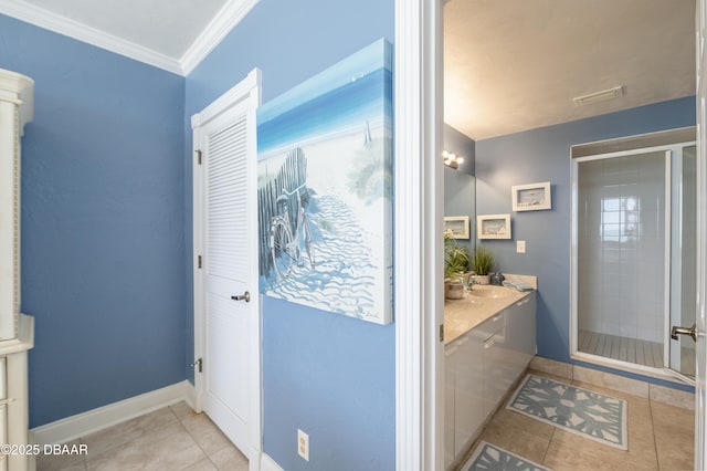 4545 S Atlantic Ave Unit 3704, Ponce Inlet, FL 32127 - full bathroom with tile patterned flooring, a stall shower, vanity, ornamental molding, and baseboards