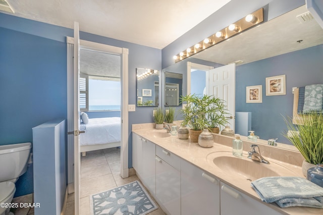 4545 S Atlantic Ave Unit 3704, Ponce Inlet, FL 32127 - ensuite bathroom featuring toilet, tile patterned flooring, and double vanity