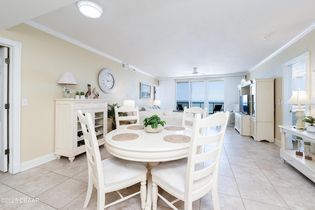 4545 S Atlantic Ave Unit 3704, Ponce Inlet, FL 32127 - dining area with a ceiling fan, light tile patterned floors, baseboards, ornamental molding, and visible vents