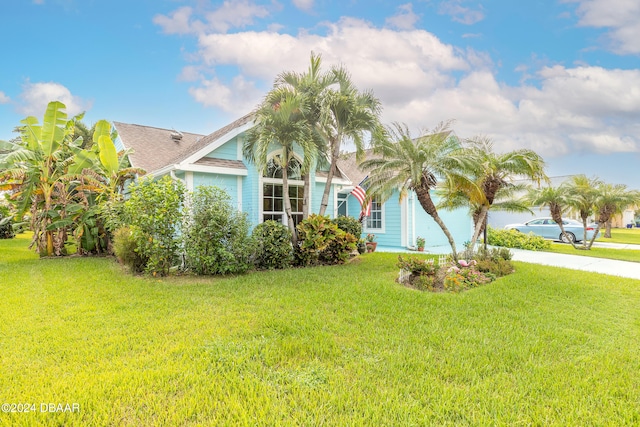 obstructed view of property featuring a front yard