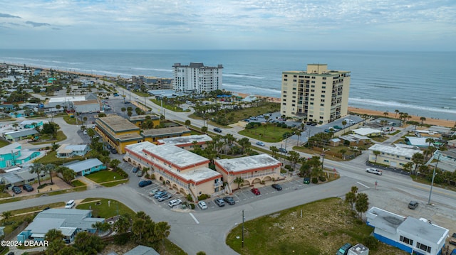 aerial view featuring a water view and a view of the beach