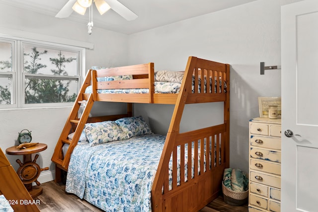 bedroom with hardwood / wood-style flooring and ceiling fan