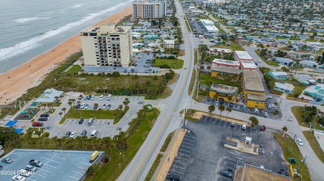 bird's eye view featuring a view of the beach and a water view