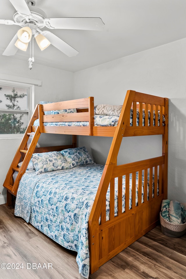 bedroom with hardwood / wood-style flooring and ceiling fan