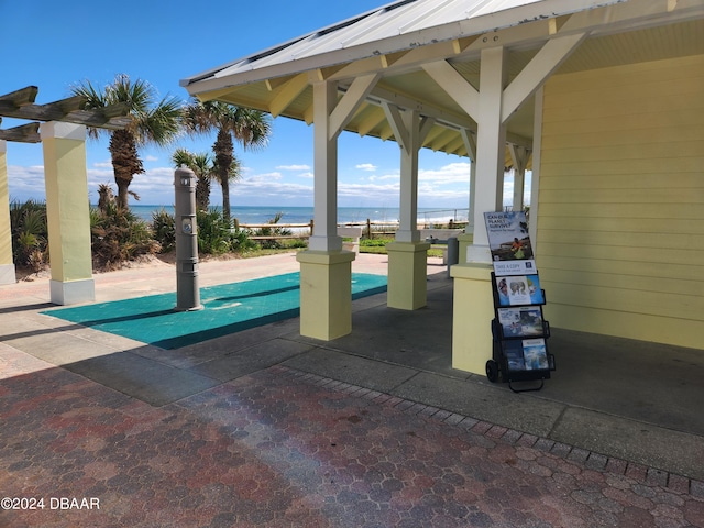 exterior space with a gazebo and a water view