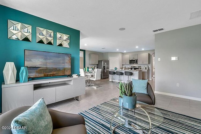 living room with light tile patterned floors